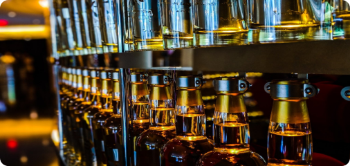 a photo of spirits organized in a shelf